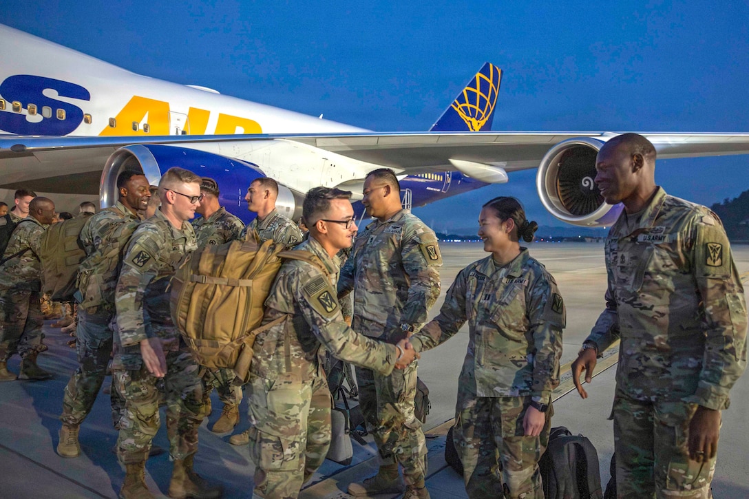 Soldiers of 2nd Battalion, 1st Air Defense Artillery Regiment, 35th Air Defense Artillery Brigade are greeted by Eighth Army and 35th ADA leaders as they deplane at Osan Air Base, South Korea, Oct. 30, 2025. The 2-1 ADA Battalion departed the Korean peninsula in March on short-notice orders to provide critical air and missile defense for key U.S. and coalition assets in the U.S. Central Command area of responsibility.