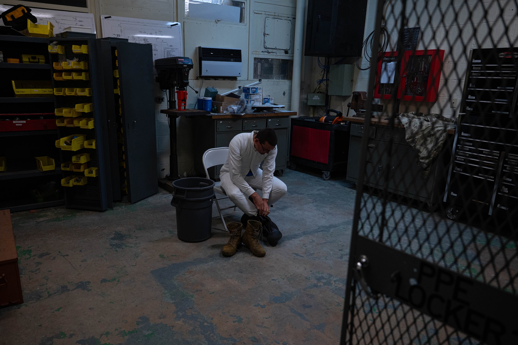 U.S. Air Force Staff Sgt. Andrew Zak, 18th Logistics Readiness Squadron petroleum, oils, and lubricants section lead, dons chemical protection gear.