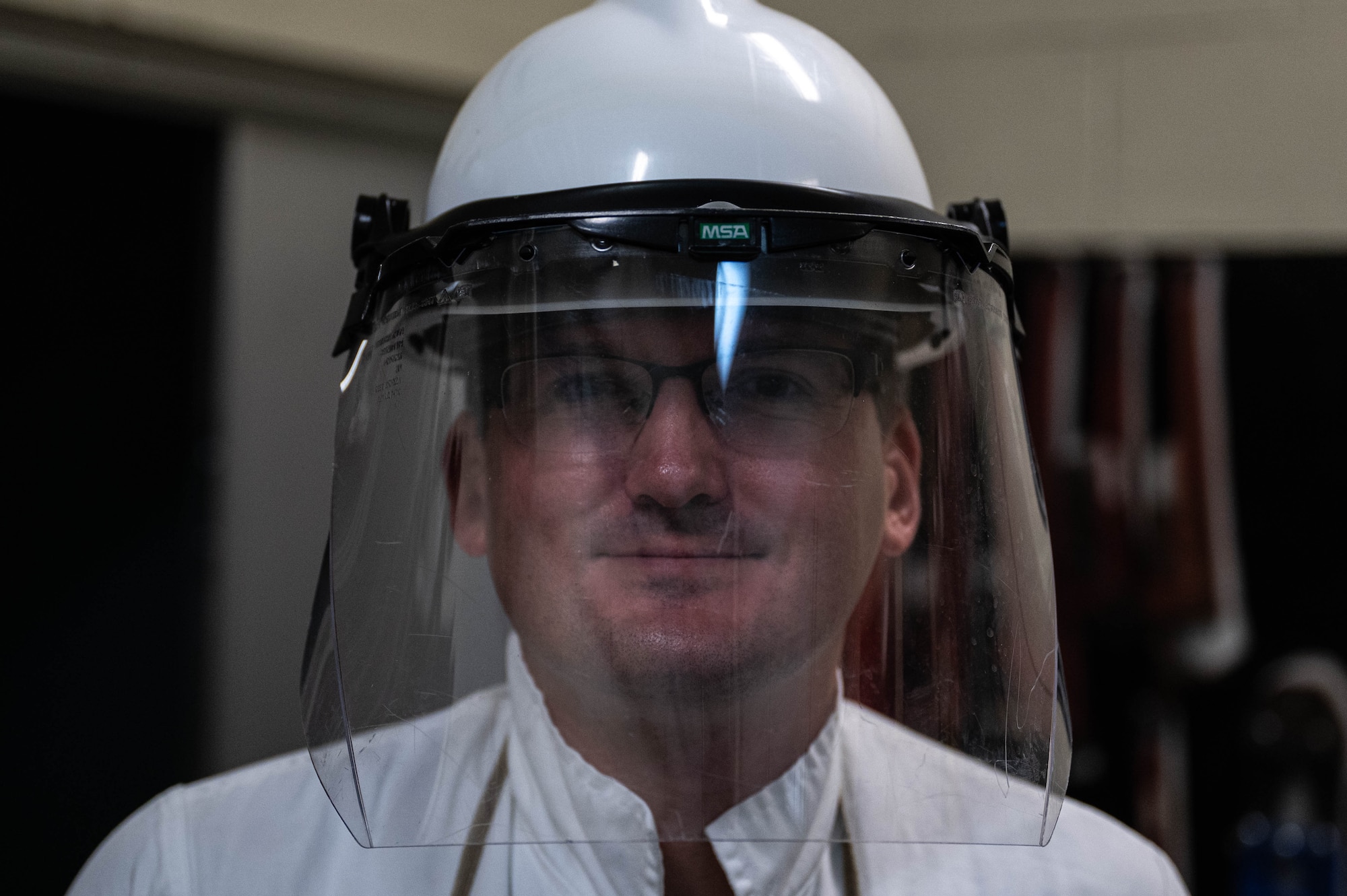 U.S. Air Force Staff Sgt. Andrew Zak, 18th Logistics Readiness Squadron petroleum, oils, and lubricants section lead, poses for a photo while performing an emergency liquid oxygen refill training exercise.