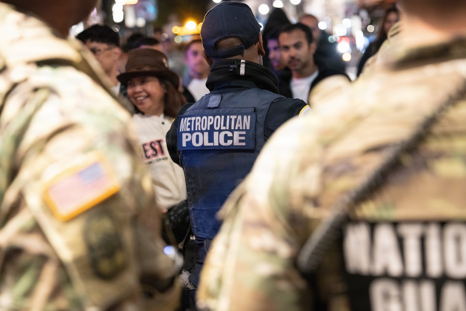 Metropolitan Police Department officers and National Guardsmen supporting the D.C. Safe and Beautiful mission patrol the streets in Washington, D.C., Oct. 31, 2025. About 2,400 National Guard members support the D.C. Safe and Beautiful mission, assisting the Metropolitan Police Department in maintaining public safety for residents, commuters and visitors throughout the District.
