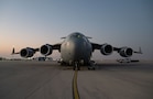 A U.S. Air Force C-17 Globemaster III aircraft assigned to the 16th Expeditionary Airlift Squadron sits on the flight line before a cargo mission in the U.S. Central Command area of responsibility, Oct. 25, 2025. The C-17 is capable of rapid strategic delivery of troops and all types of cargo in the CENTCOM AOR to maintain peace and stability across the region. (U.S. Air Force photo by Tech. Sgt. Bailee A. Darbasie)