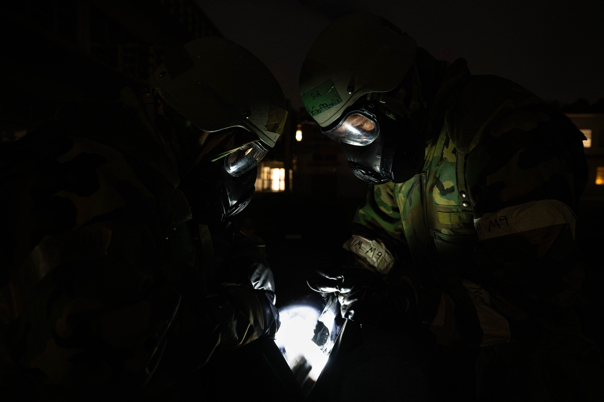 Two U.S. Air Force Airmen assigned to the 18th Comptroller Squadron perform tactical combat casualty care during a mass casualty exercise in support of base-wide operational readiness exercise BH 26-1 at Kadena Air Base, Japan, Nov. 6, 2025. The event was designed to reinforce teamwork and emergency response skills under pressure. (U.S. Air Force photo by Airman Nathaniel Jackson)