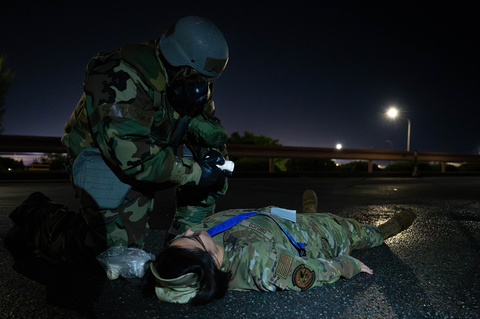 A U.S. Air Force Airman assigned to the 18th Comptroller Squadron performs tactical combat casualty care during a mass casualty exercise in support of base-wide operational readiness exercise BH 26-1 at Kadena Air Base, Japan, Nov. 6, 2025. The exercise tested the unit’s ability to respond quickly and effectively to simulated emergencies. (U.S. Air Force photo by Airman Nathaniel Jackson)