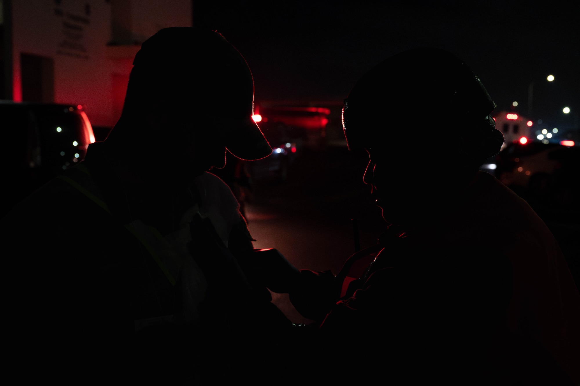 U.S. Air Force Airmen assigned to the 18th Operational Medical Readiness Squadron, simulate injuries and perform tactical combat casualty care during a mass casualty exercise in support of base-wide operational readiness exercise BH 26-1 at Kadena Air Base, Japan, Nov. 6, 2025. Firefighters, medical teams, and supporting units worked together to secure the area, treat patients, and coordinate recovery efforts. (U.S. Air Force photo by Airman Nathaniel Jackson)