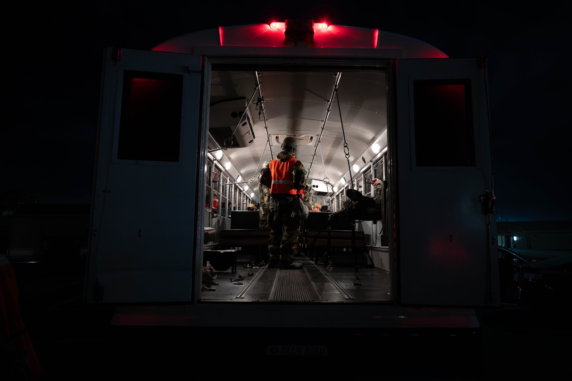 U.S. Airforce Airmen assigned to the 18th Operational Medical Readiness Squadron load simulated injured patients into a medical bus during a mass casualty exercise in support of base-wide operational readiness exercise BH 26-1 at Kadena Air Base, Japan, Nov. 6, 2025. The event tested Kadena’s ability to respond to large-scale emergencies through rapid treatment and coordinated evacuation. (U.S. Air Force photo by Airman Nathaniel Jackson)