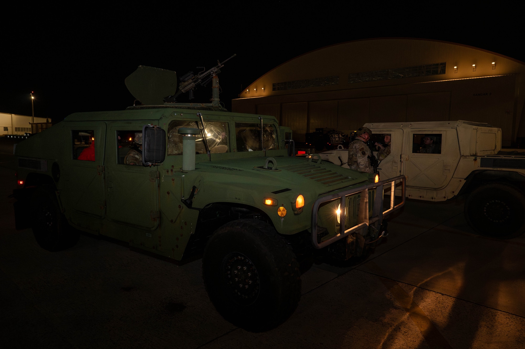 U.S. Air Force Airmen assigned to the 18th Security Forces Squadron detain a simulated intruder on the flightline in support of base-wide operational readiness exercise BH 26-1 at Kadena Air Base, Japan, Nov. 6, 2025. The scenario emphasized coordination between maintainers and defenders to protect aircraft and personnel in restricted areas. (U.S. Air Force photo by Airman Nathaniel Jackson)