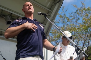 An Airman speaks to the public.