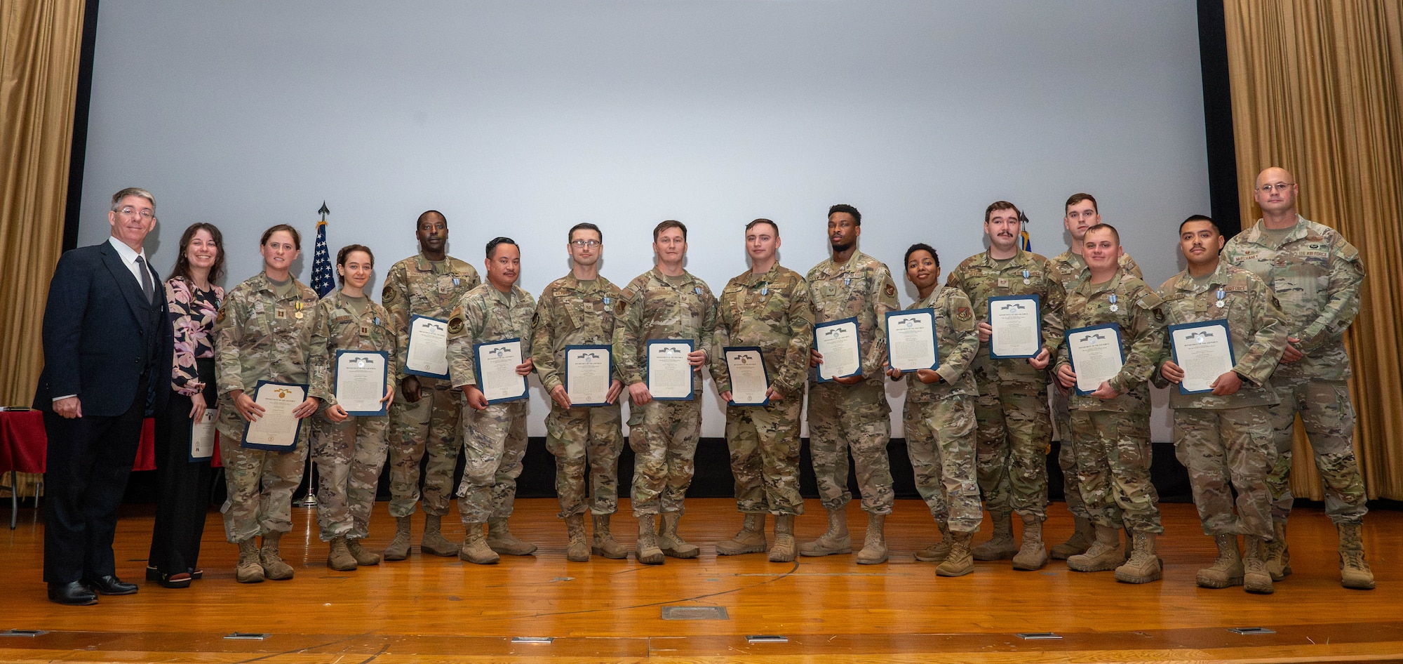 Medal recipients pose for a group photo.