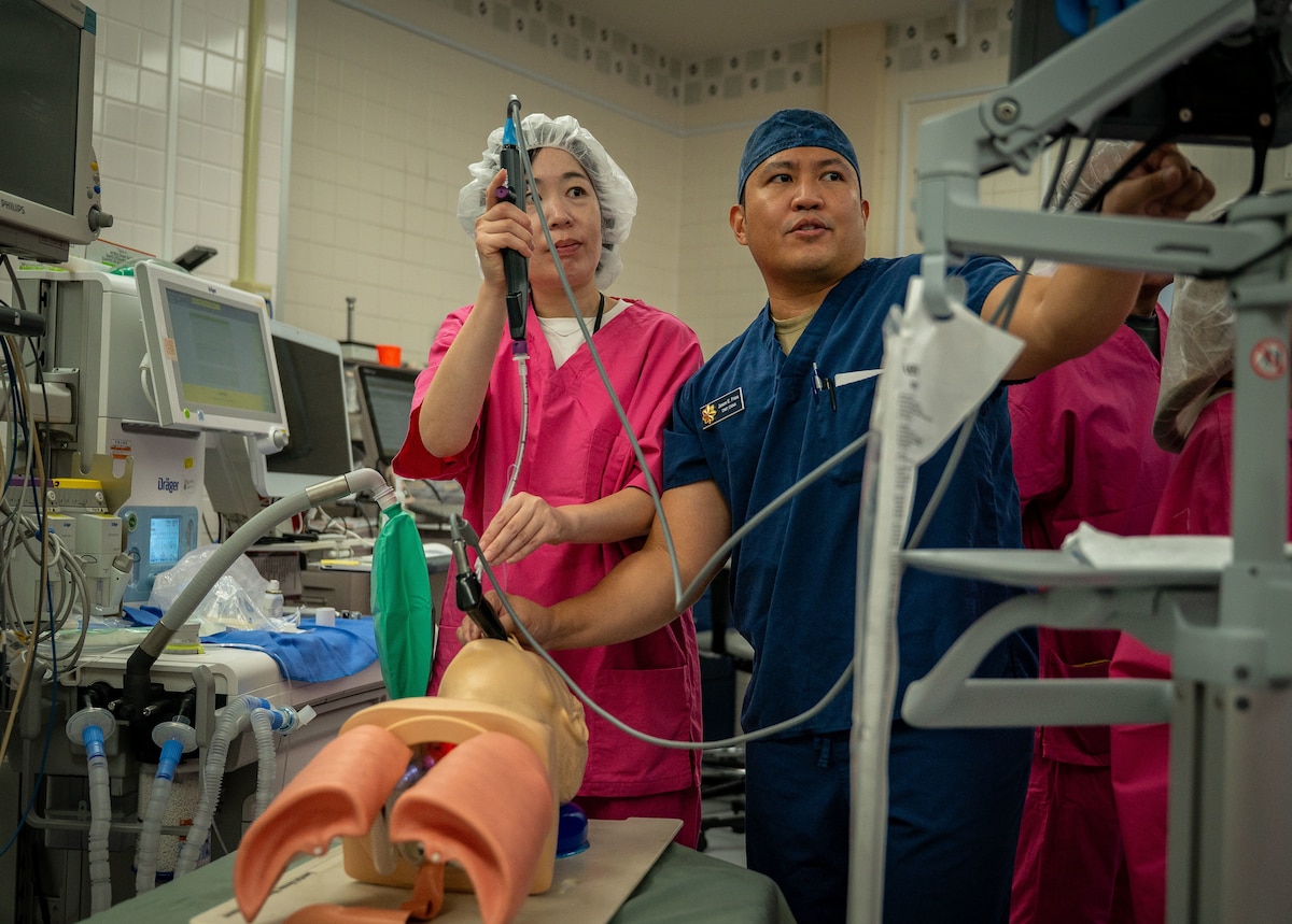 U.S. Air Force Maj. Jason Frias, 374th Surgical Operation Squadron nurse anesthetist, demonstrates the induction of anesthesia.