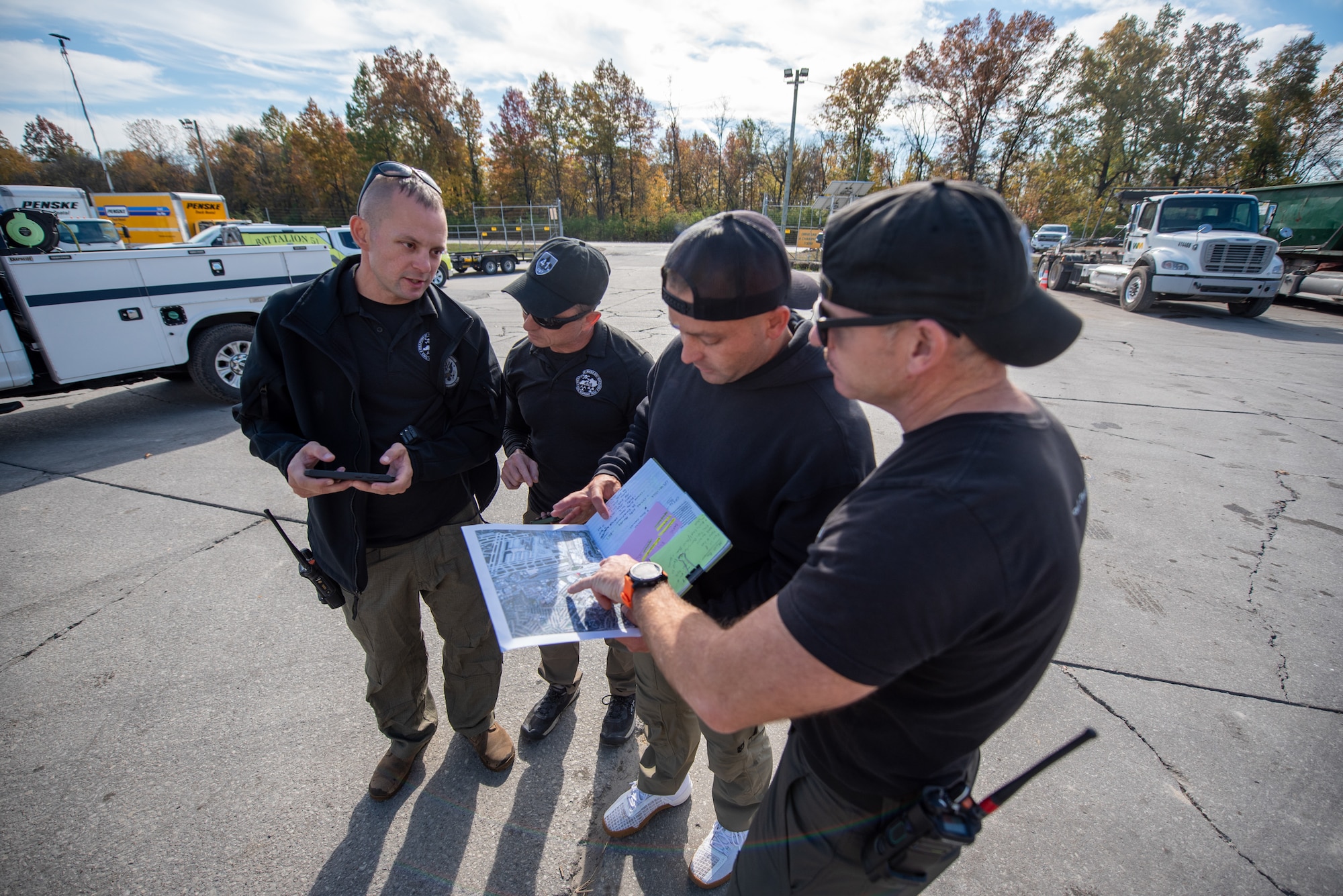 Members of the Kentucky National Guard’s 41st Civil Support Team discuss a plan to test the air quality in Louisville, Ky., Nov. 5, 2025, following the fatal crash of a civilian airplane two days earlier. A United Parcel Service MD-11 cargo plane impacted several buildings and a petroleum recycling facility just south of Louisville Muhammad Ali International Airport Nov. 4, igniting a fire that burned for hours. (U.S. Air National Guard photo by Phil Speck)