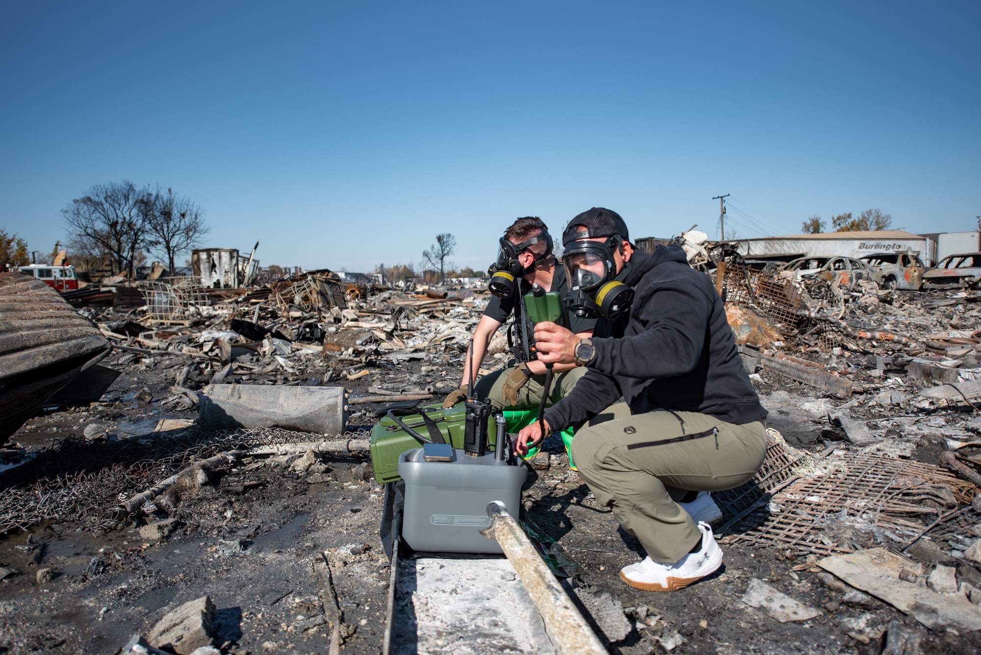 Members of the Kentucky National Guard’s 41st Civil Support Team use a portable gas chromatograph mass spectrometer in Louisville, Ky., Nov. 5, 2025, to test for airborne toxic chemicals at the site of a fatal civilian airplane crash. A United Parcel Service MD-11 cargo plane impacted several buildings and a petroleum recycling facility just south of Louisville Muhammad Ali International Airport Nov. 4, igniting a fire that burned for hours. (U.S. Air National Guard photo by Phil Speck)