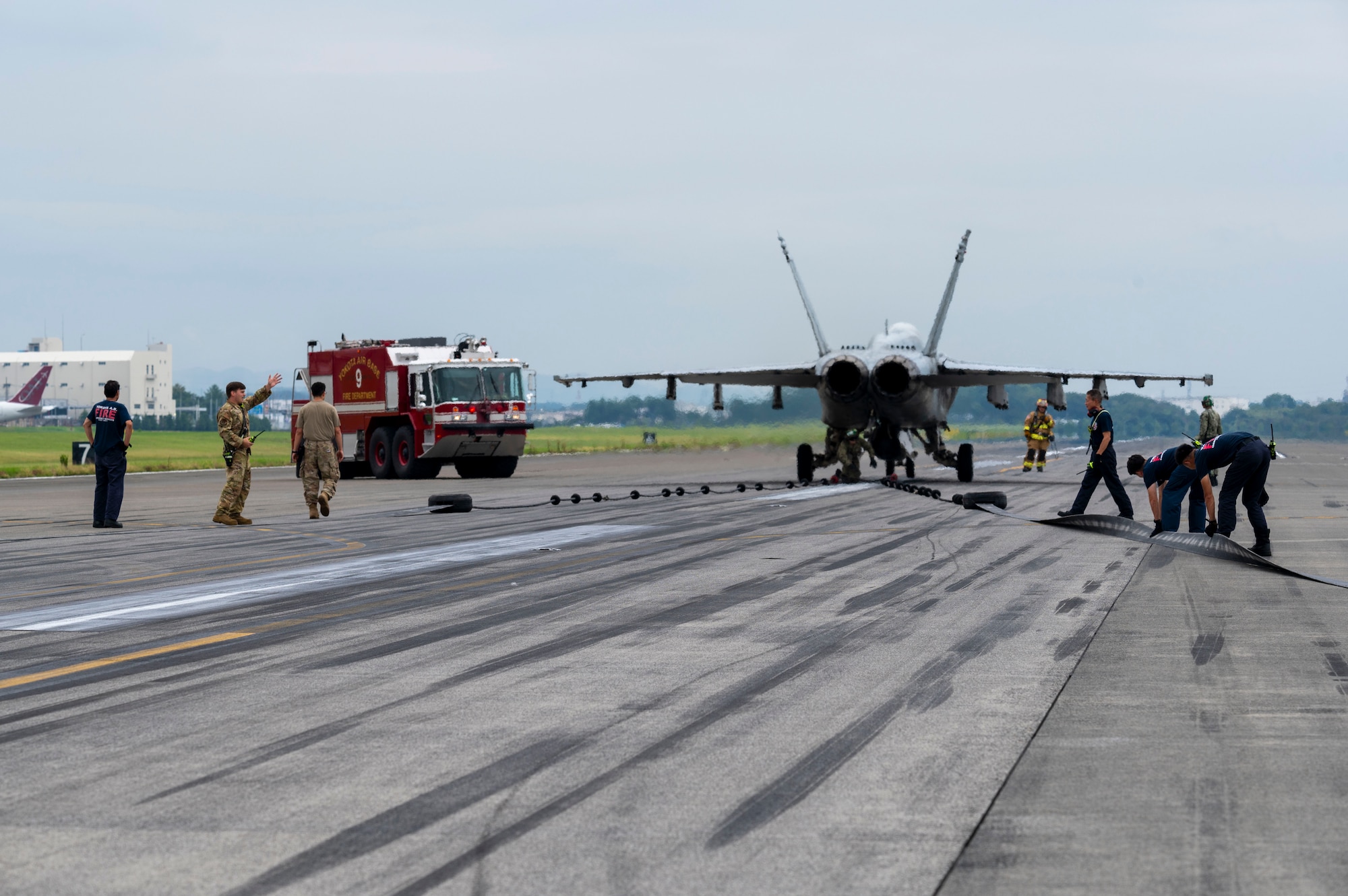 A U.S. Navy F/A-18F Super Hornet pauses on the flightline after an aircraft arresting system test.