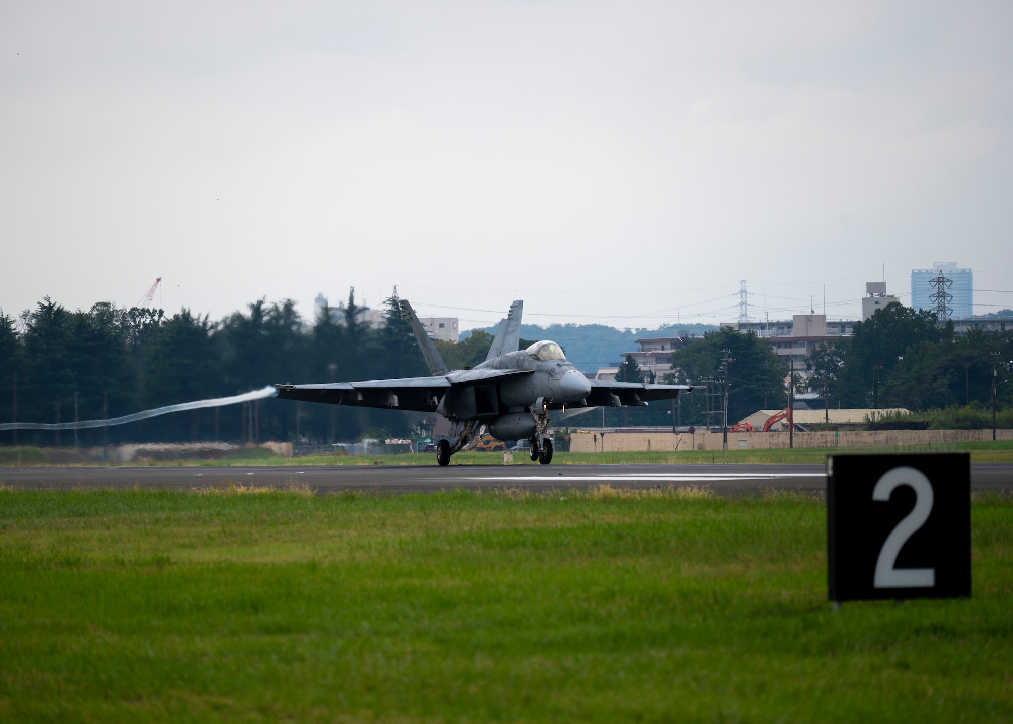 A U.S. Navy F/A-18F Super Hornet lands on the runway.