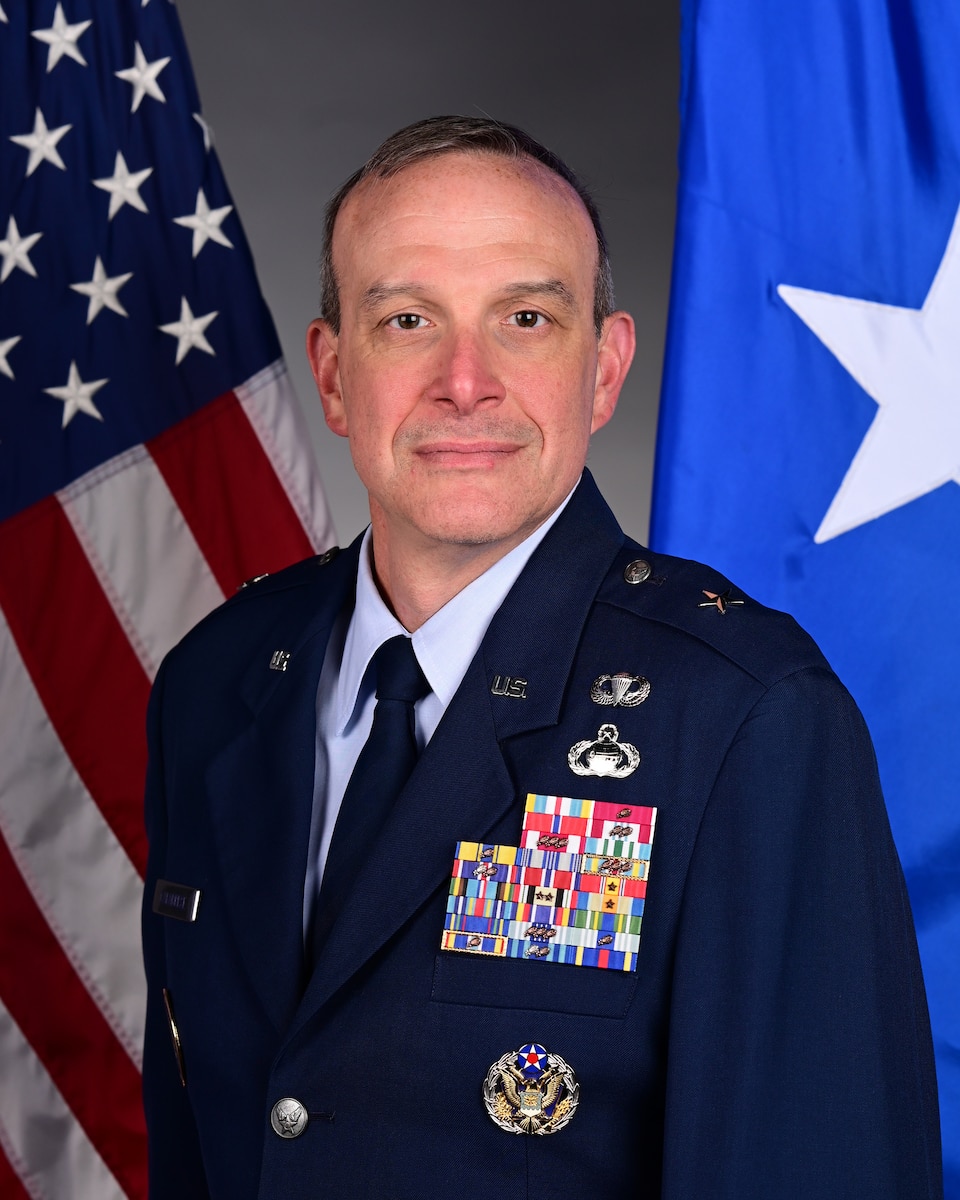 A military member poses for a portrait.