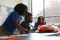 The D.C. National Guard Counterdrug Drug Demand Reduction Outreach team delivers a drug prevention presentation to students at Ballou STAY Opportunity Academy on Oct. 24, 2025, in recognition of Red Ribbon Week in Washington D.C. The session aimed to spark candid discussions about substance misuse and highlight the importance of making healthy, informed decisions. The DDRO outreach team emphasized its ongoing mission to combat drug abuse through education, awareness, and interactive programs designed to empower young people.