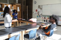 The D.C. National Guard Counterdrug Drug Demand Reduction Outreach team delivers a drug prevention presentation to students at Ballou STAY Opportunity Academy on Oct. 24, 2025, in recognition of Red Ribbon Week in Washington D.C. The session aimed to spark candid discussions about substance misuse and highlight the importance of making healthy, informed decisions. The DDRO outreach team emphasized its ongoing mission to combat drug abuse through education, awareness, and interactive programs designed to empower young people.