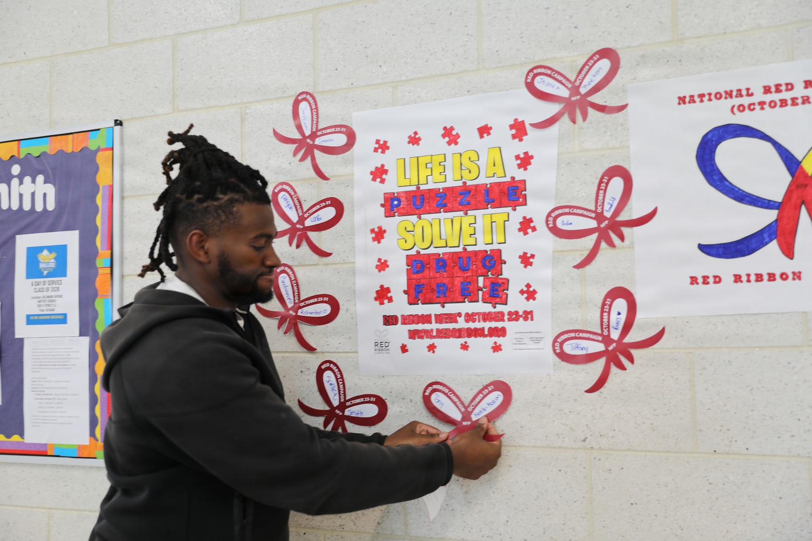 The D.C. National Guard Counterdrug Drug Demand Reduction Outreach team delivers a drug prevention presentation to students at Ballou STAY Opportunity Academy on Oct. 24, 2025, in recognition of Red Ribbon Week in Washington D.C. The session aimed to spark candid discussions about substance misuse and highlight the importance of making healthy, informed decisions. The DDRO outreach team emphasized its ongoing mission to combat drug abuse through education, awareness, and interactive programs designed to empower young people.