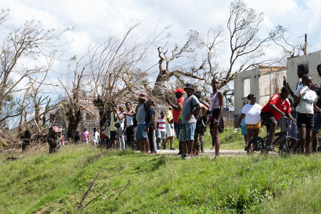 People stand on top of a hill