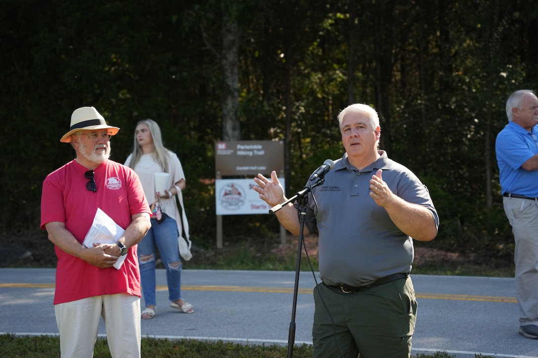 Granville, Tenn. (Sept. 27, 2025) — Kenny Claywell, U.S. Army Corps of Engineers natural resources program manager, delivers remarks during a ceremony at the new Storybook Trail on Periwinkle Trail at Cordell Hull Lake. John Deane (left) stands beside him. (USACE photo by Noe Gonzalez)
