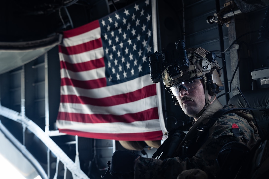 A U.S. Marine with Maritime Raid Force, 31st Marine Expeditionary Unit, transports to the amphibious dock landing ship USS Rushmore (LSD 47) in a CH-53E Super Stallion assigned to Marine Medium Tiltrotor Squadron (VMM) 265 (Rein.), 31st MEU, during a visit, board, search and seizure exercise, in the Coral Sea, June 28, 2025. VBSS is part of the maritime interception operations that aim to delay, disrupt, or destroy enemy forces or supplies in the maritime domain. The 31st MEU is operating aboard ships of the USS America Amphibious Ready Group in the 7th Fleet area of operations, the U.S. Navy’s largest forward-deployed numbered fleet, and routinely interacts and operates with allies and partners in preserving a free and open Indo-Pacific region. (U.S. Marine Corps photo by Cpl. Alora Finigan)