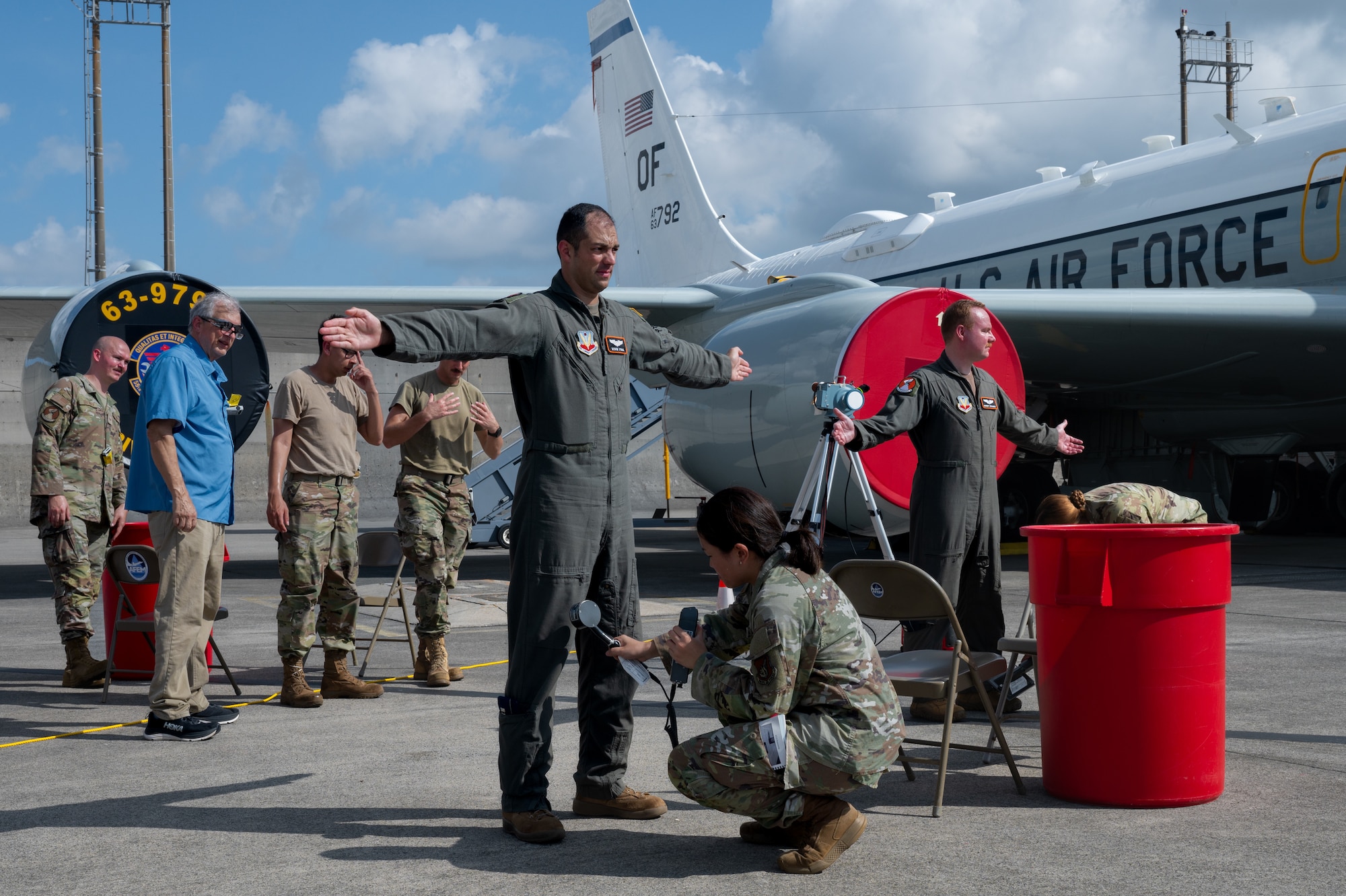 Service members go through a simulated contamination control center during an exercise.
