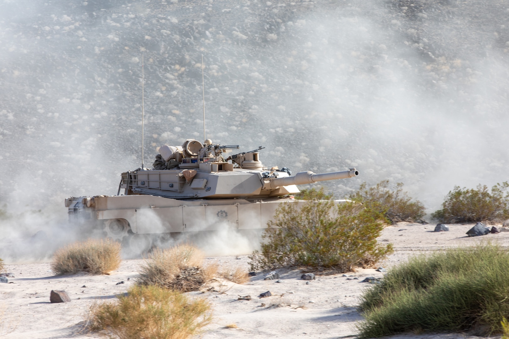 Soldiers of the Royal Saudi Land Forces (RSLF), equipped with M1 Abrams main battle tanks, conduct force-on-force operations for the first time at the National Training Center during Rotation 26-02 at Fort Irwin, Calif., Nov. 4, 2025. Partnering with U.S. Army Central, the RSLF, and 3rd Security Forces Assistance Brigade, will integrate with 2nd Brigade, 1st Cavalry Division to improve interoperability and operational effectiveness in a tough, realistic environment. (U.S. Army photo by Staff Sgt. Devon Jones)