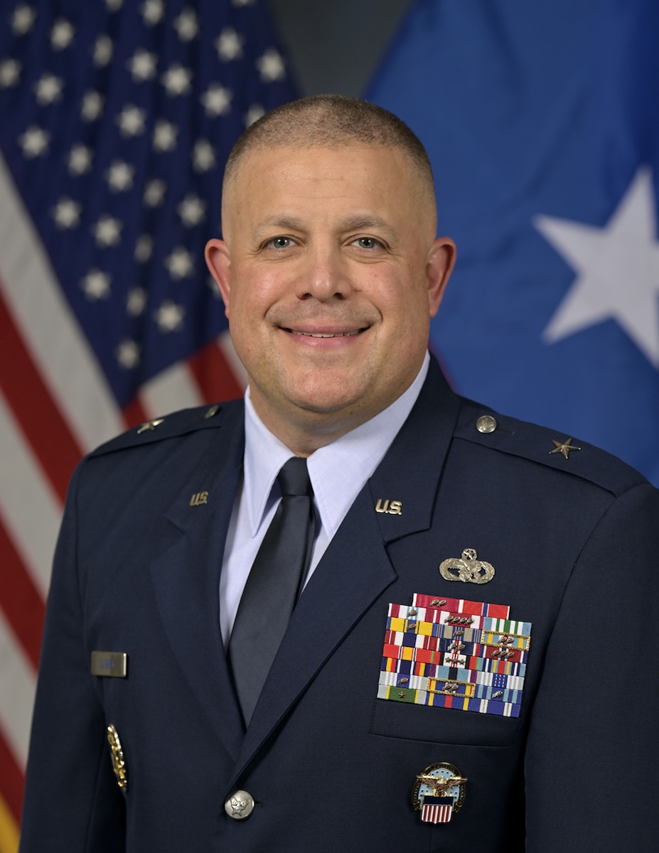 A military members poses for a portrait.