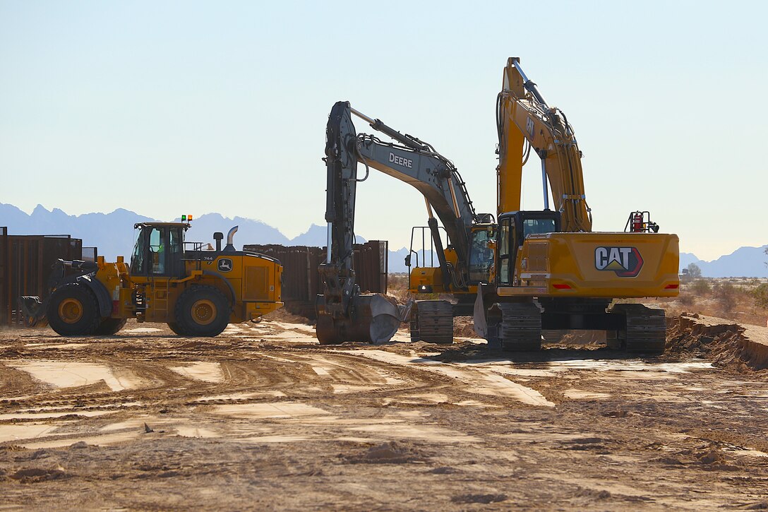 Outdated fencing is removed and replaced with new bollard-style barrier panels installed by U.S. Army Corps of Engineers South Pacific Border Task Force contractors near Yuma, Arizona, Oct 15. The BMGR-1 border barrier project spans approximately 15 miles, replacing older fencing with steel bollard barriers. USACE is replacing permanent border barriers along the southern border of the U.S. at the direction of the U.S. Army by the Secretary of War, in response to the presidential national emergency declaration dated Jan. 20, 2025, authorizing the use of Section 2803 of Title 10, U.S. Code. (Photo by Robert DeDeaux USACE PAO)