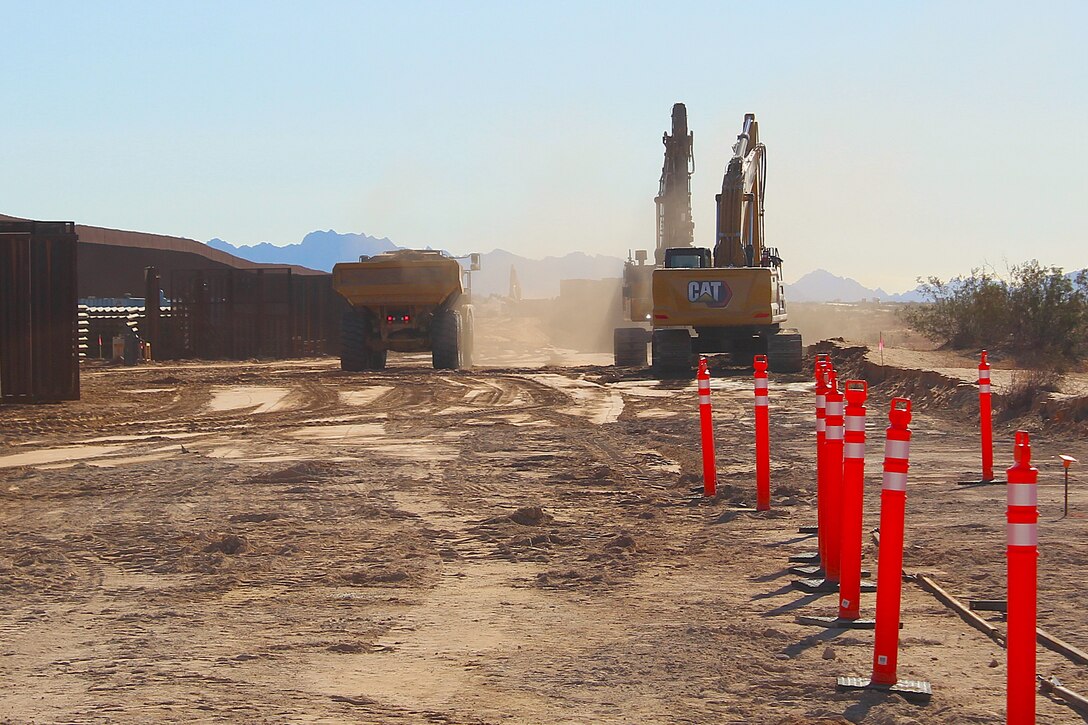 Outdated fencing is removed and replaced with new bollard-style barrier panels installed by U.S. Army Corps of Engineers South Pacific Border Task Force contractors near Yuma, Arizona, Oct 15. The BMGR-1 border barrier project spans approximately 15 miles, replacing older fencing with steel bollard barriers. USACE is replacing permanent border barriers along the southern border of the U.S. at the direction of the U.S. Army by the Secretary of War, in response to the presidential national emergency declaration dated Jan. 20, 2025, authorizing the use of Section 2803 of Title 10, U.S. Code. (Photo by Robert DeDeaux USACE PAO)