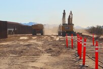 Outdated fencing is removed and replaced with new bollard-style barrier panels installed by U.S. Army Corps of Engineers South Pacific Border Task Force contractors near Yuma, Arizona, Oct 15. The BMGR-1 border barrier project spans approximately 15 miles, replacing older fencing with steel bollard barriers. USACE is replacing permanent border barriers along the southern border of the U.S. at the direction of the U.S. Army by the Secretary of War, in response to the presidential national emergency declaration dated Jan. 20, 2025, authorizing the use of Section 2803 of Title 10, U.S. Code. (Photo by Robert DeDeaux USACE PAO)