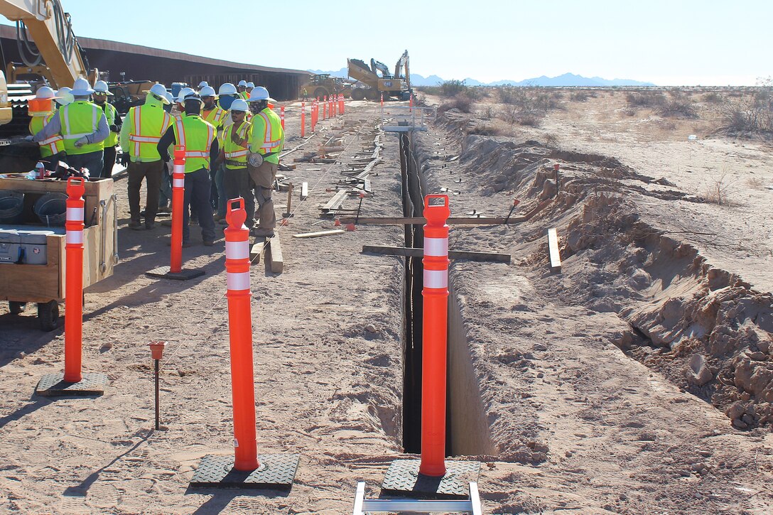 Outdated fencing is removed and replaced with new bollard-style barrier panels installed by U.S. Army Corps of Engineers South Pacific Border Task Force contractors near Yuma, Arizona, Oct 15. The BMGR-1 border barrier project spans approximately 15 miles, replacing older fencing with steel bollard barriers. USACE is replacing permanent border barriers along the southern border of the U.S. at the direction of the U.S. Army by the Secretary of War, in response to the presidential national emergency declaration dated Jan. 20, 2025, authorizing the use of Section 2803 of Title 10, U.S. Code. (Photo by Robert DeDeaux USACE PAO)
