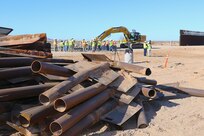 Outdated fencing is removed and replaced with new bollard-style barrier panels installed by U.S. Army Corps of Engineers South Pacific Border Task Force contractors near Yuma, Arizona, Oct 15. The BMGR-1 border barrier project spans approximately 15 miles, replacing older fencing with steel bollard barriers. USACE is replacing permanent border barriers along the southern border of the U.S. at the direction of the U.S. Army by the Secretary of War, in response to the presidential national emergency declaration dated Jan. 20, 2025, authorizing the use of Section 2803 of Title 10, U.S. Code. (Photo by Robert DeDeaux USACE PAO)
