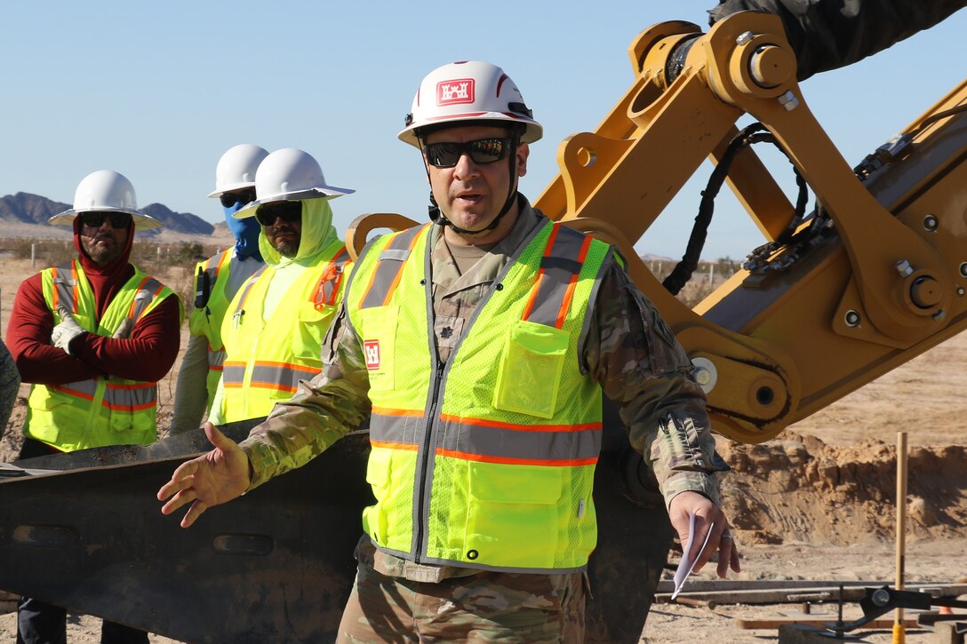 U.S. Army Corps of Engineers South Pacific Border Task Force Commander Lt. Col. Jeffrey Beeman addresses employees and contactors before construction begins at the BMGR-1 project site near Yuma, Arizona, Oct. 15. USACE is replacing permanent border barriers along the southern border of the U.S. at the direction of the U.S. Army by the Secretary of War, in response to the presidential national emergency declaration dated Jan. 20, 2025, authorizing the use of Section 2803 of Title 10, U.S. Code. (Photo by Robert DeDeaux USACE PAO)
