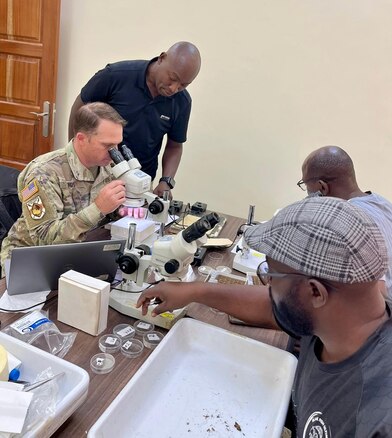 Maj. Eads reviews tick specimens collected by the WRAIR-Africa Entomology team.
