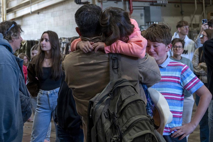Members of the 171st Air Refueling Wing are welcomed home from deployment by family and friends Oct. 26, 2025, in Coraopolis, Pennsylvania. More than 120 Airmen returned after a 150-day deployment to the Middle East in support of Operation Spartan Shield. (U.S. Air National Guard photo by Tech. Sgt. Zoe M. Wockenfuss)