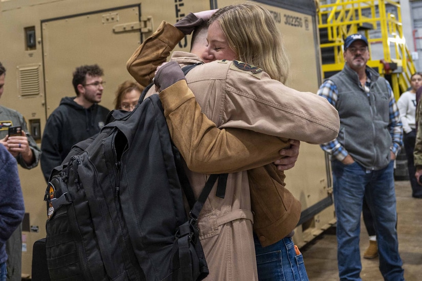 Members of the 171st Air Refueling Wing are welcomed home from deployment by family and friends Oct. 26, 2025, in Coraopolis, Pennsylvania. More than 120 Airmen returned after a 150-day deployment to the Middle East in support of Operation Spartan Shield. (U.S. Air National Guard photo by Tech. Sgt. Zoe M. Wockenfuss)