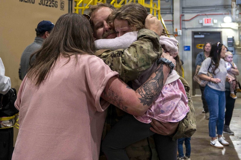Members of the 171st Air Refueling Wing are welcomed home from deployment by family and friends Oct. 26, 2025, in Coraopolis, Pennsylvania. More than 120 Airmen returned after a 150-day deployment to the Middle East in support of Operation Spartan Shield. (U.S. Air National Guard photo by Tech. Sgt. Zoe M. Wockenfuss)