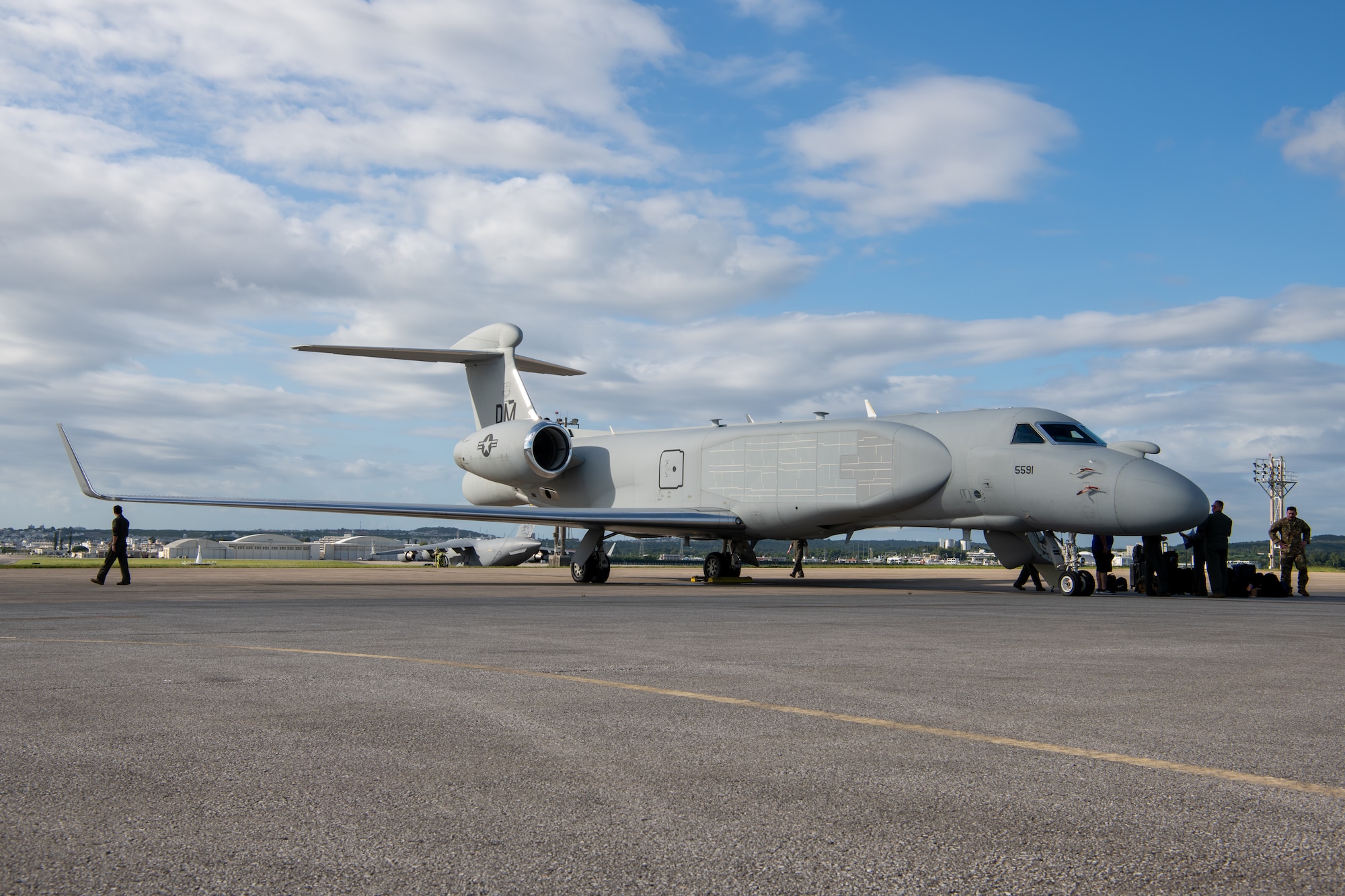 Right side view of an aircraft on the flight line with crew unloading