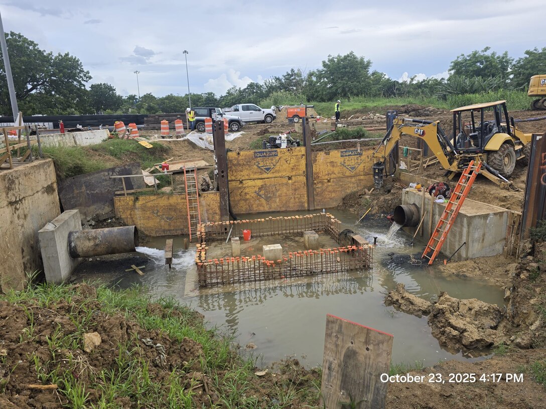 Workers relocate a critical water line in San Juan during the Roosevelt Avenue Bridge replacement