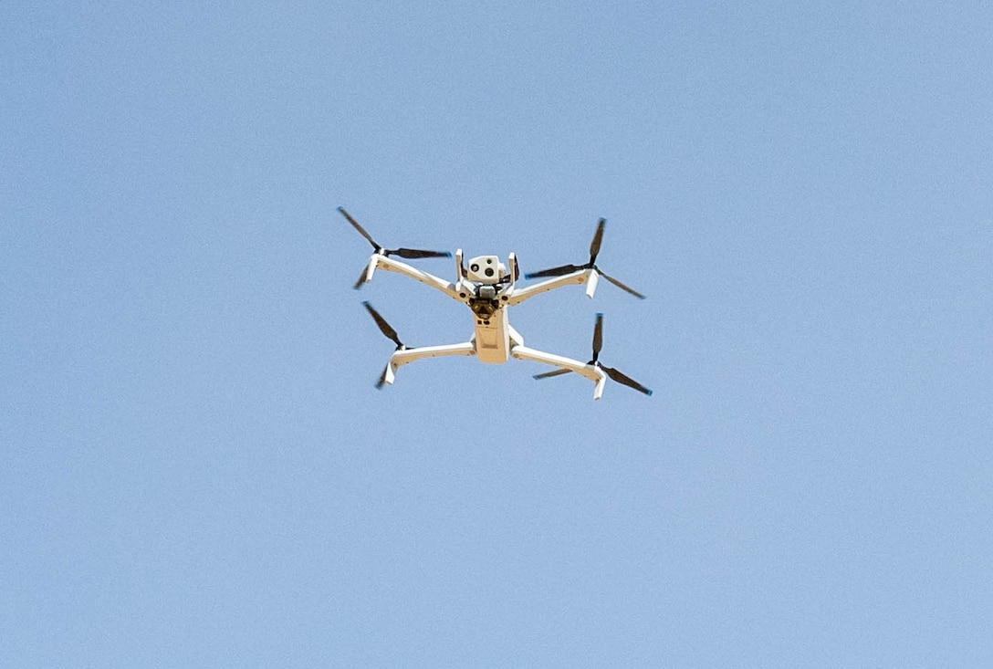 A Skydio quadcopter hovers in the U.S. Central Command area of responsibility Nov. 6, 2025. The quadcopter is equipped with multiple camera capabilities, including a 360-degree field of view, thermal imaging and advanced high-resolution zoom, giving defenders a detailed look at their surroundings. (U.S. Air Force photo by Senior Airman Kari Degraffenreed)