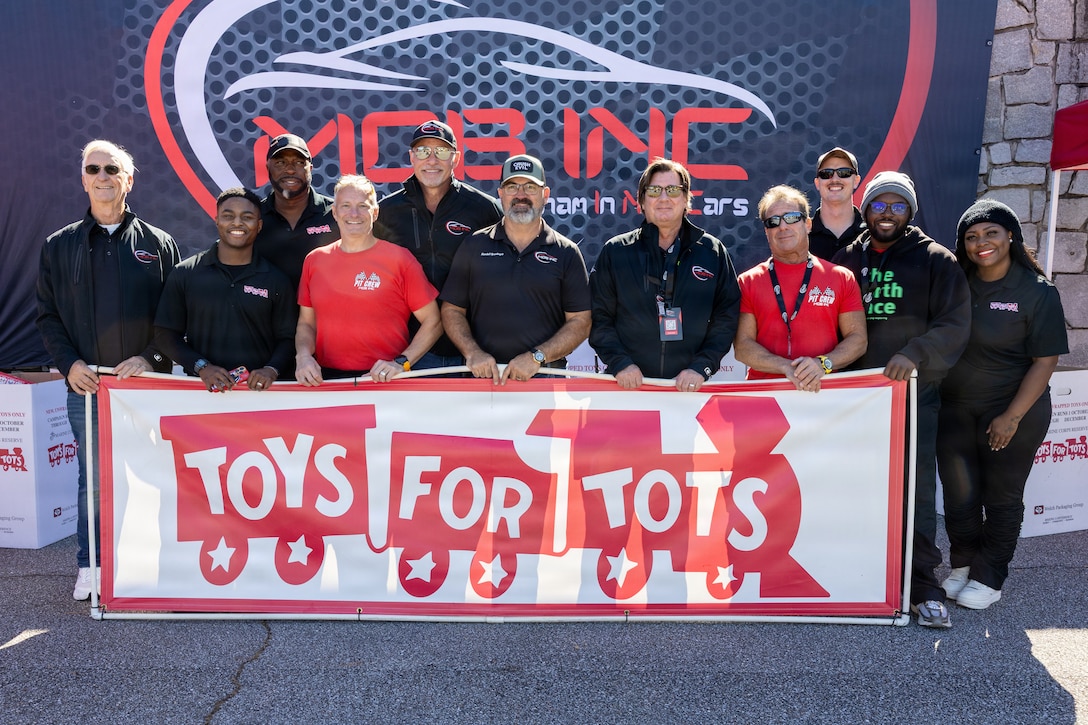 U.S. Marine Corps Toys for Tots Greater Alabama Campaign members pose for a photo during a kickoff car show hosted by Motorist of Birmingham in Nice Cars (MOBINC) to support the mission of collecting toys for families in need during the holiday season, in Birmingham, AL, on November 1st, 2025. The basic mission of the Marine Toys for Tots Program is to collect new unwrapped toys and distribute those toys to economically disadvantaged children at Christmas. (U.S. Marine Corps photo by Sgt. Ruben Padilla)