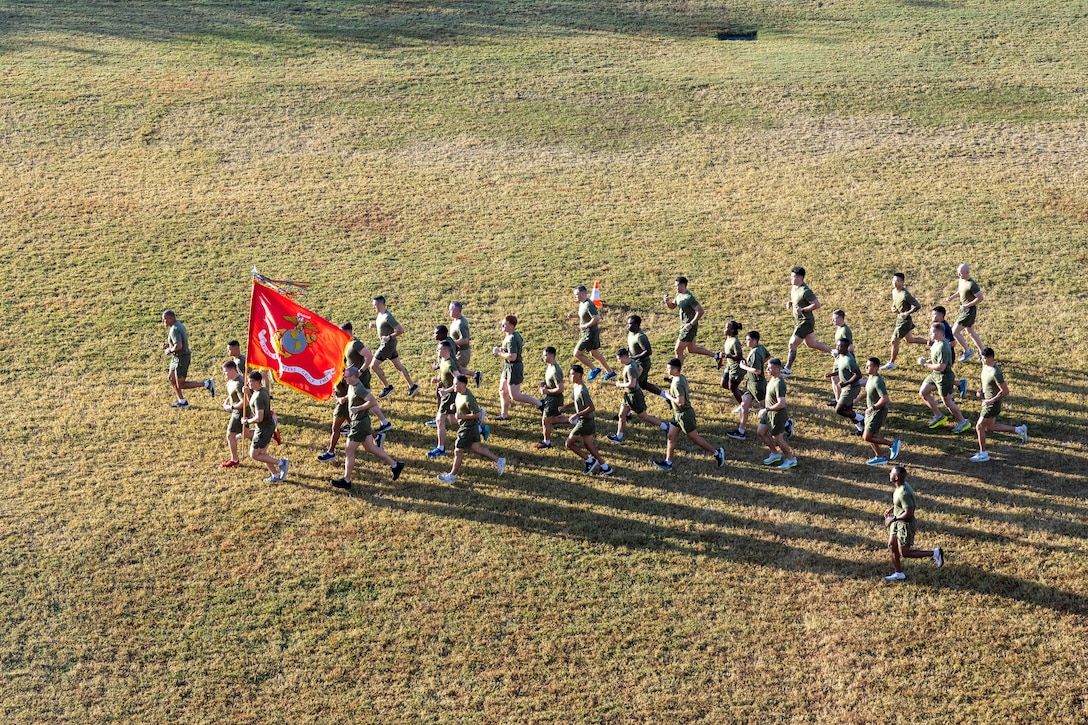 U.S. Marines and sailors with Marine Forces Reserve and Marine Forces South participate in an annual birthday motivational run celebrating the 250th birthday of the U.S. Marine Corps, in New Orleans, Nov. 7, 2025. The run started at the Marine Corps Support Facility, New Orleans and traveled along the Mississippi River ending back at Maine Corps Support Facility New Orleans. The run celebrates the history of the Marine Corps and creates esprit de corps and comradery among Marines. (U.S. Marine Corps photo by Lance Cpl. Juan Diaz/Lance Cpl. Priscilla Flores)