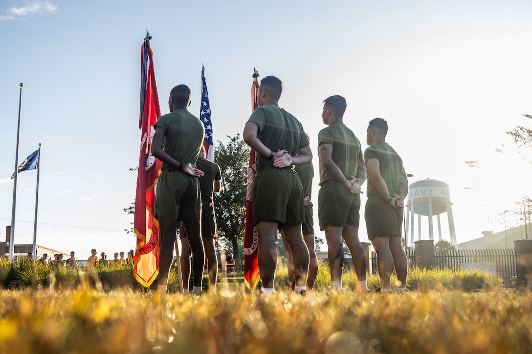 U.S. Marines with Marine Forces Reserve and Marine Forces South stand with the colors of Marine Forces Reserve and Marine Forces South in preparation of an annual birthday motivational run celebrating the 250th birthday of the U.S. Marine Corps, in New Orleans, Nov. 7, 2025. The run started at the Marine Corps Support Facility New Orleans and traveled along the Mississippi River ending back at MCSF. The run celebrates the history of the Marine Corps and creates esprit de corps and comradery among Marines. (U.S. Marine Corps photo by Lance Cpl. Edward Spears)