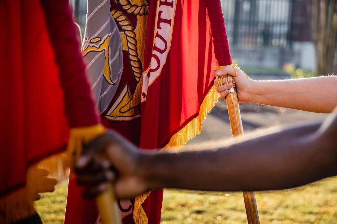 U.S. Marines with Marine Forces Reserve and Marine Forces South stand at parade rest with the colors of Marine Forces Reserve and Marine Forces South before an annual birthday motivational run celebrating the 250th birthday of the U.S. Marine Corps, in New Orleans, Nov. 7, 2025. The run started at the Marine Corps Support Facility New Orleans and traveled along the Mississippi River ending back at MCSF. The run celebrates the history of the Marine Corps and creates esprit de corps and comradery among Marines. (U.S. Marine Corps photo by Lance Cpl. Edward Spears)