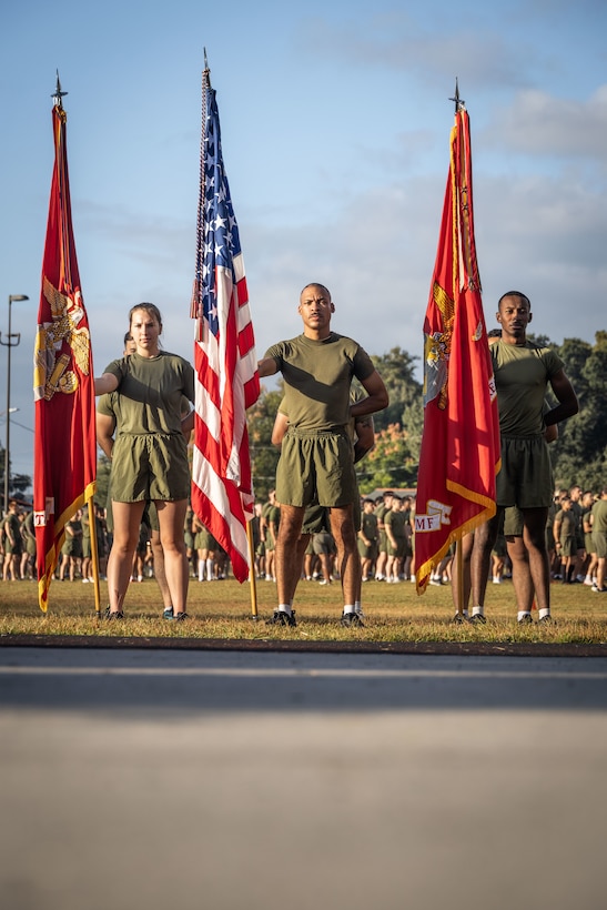 U.S. Marines with Marine Forces Reserve and Marine Forces South stand at parade rest with the colors of Marine Forces Reserve and Marine Forces South before an annual birthday motivational run celebrating the 250th birthday of the U.S. Marine Corps, in New Orleans, Nov. 7, 2025. The run started at the Marine Corps Support Facility New Orleans and traveled along the Mississippi River ending back at MCSF. The run celebrates the history of the Marine Corps and creates esprit de corps and comradery among Marines. (U.S. Marine Corps photo by Lance Cpl. Edward Spears)