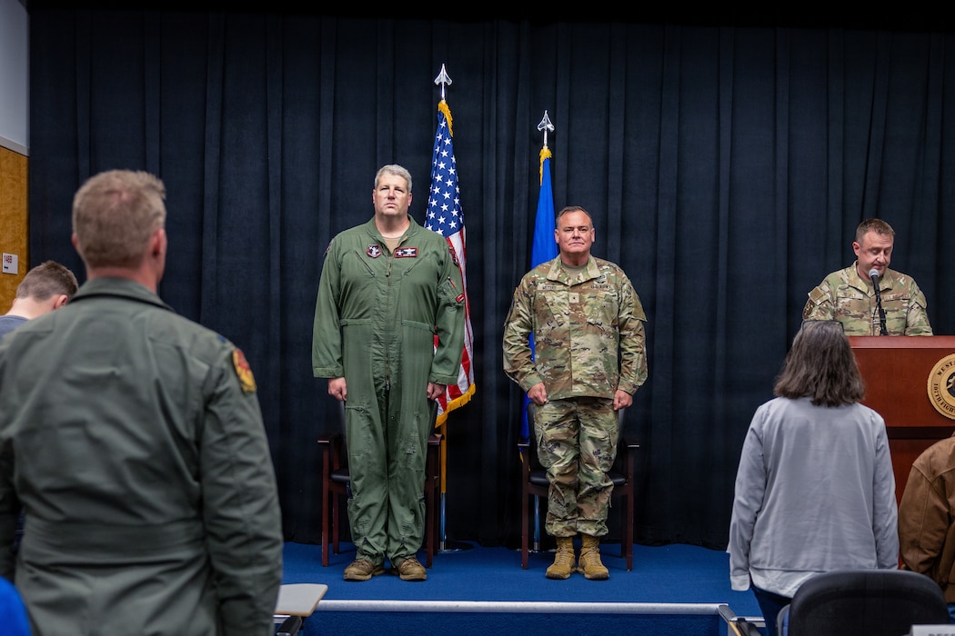 U.S. Air Force Lt. Col. Bart Ward, an A-10C Thunderbolt II aircraft pilot, assigned to the 107th Fighter Squadron, Michigan Air National Guard, left, and U.S. Army Brig. Gen. Scott L. Meyers, Assistant Adjutant General, Michigan Army National Guard stand at attention during Ward's retirement ceremony at Selfridge Air National Guard Base, Michigan, Nov. 1, 2025. Ward retired from the military with more than 1,100 hours combat flying hours.