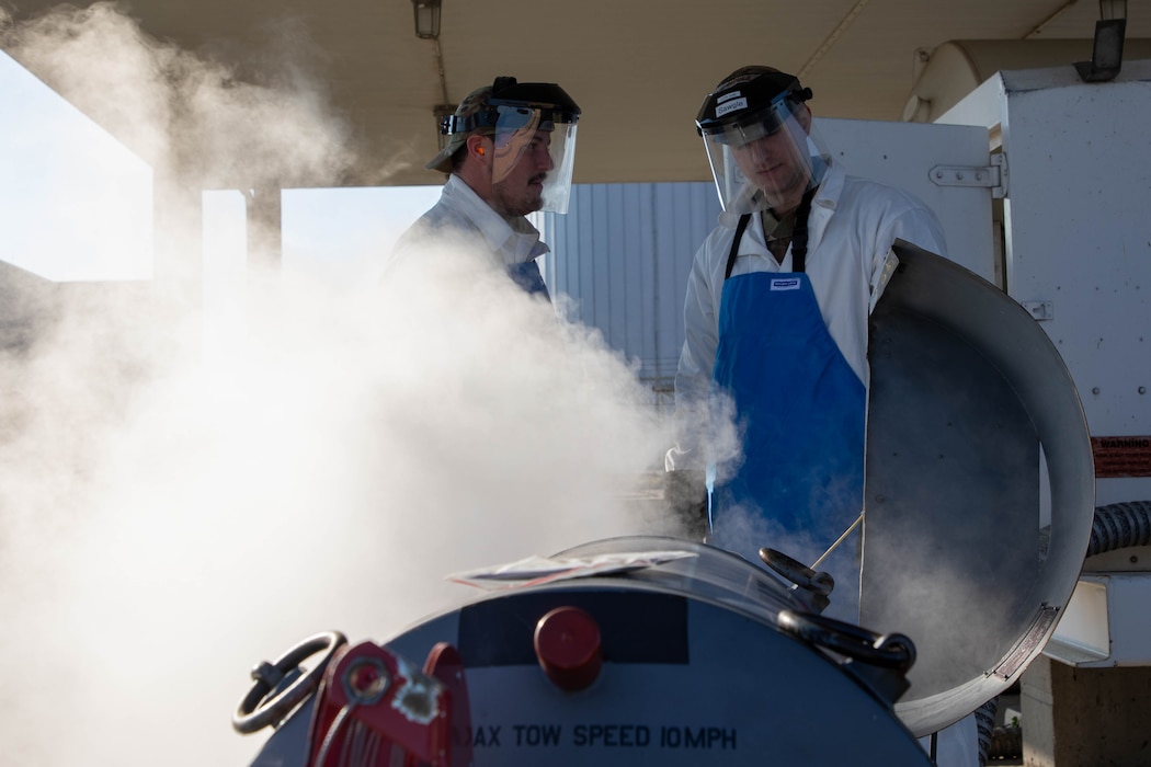 U.S. Air Force Tech. Sgt. Nicholas Bousquette, left, and Staff Sgt. Devin Houle, both fuels management specialists with the 127th Logistics Readiness Squadron, Michigan National Guard,, transfer liquid oxygen from a 3,000 gallon storage tank to a 50-gallon issuing tank at Selfridge Air National Guard Base, Michigan, Nov. 2, 2025. This oxygen is essential for pilots to breathe comfortably while flying at high altitudes.
