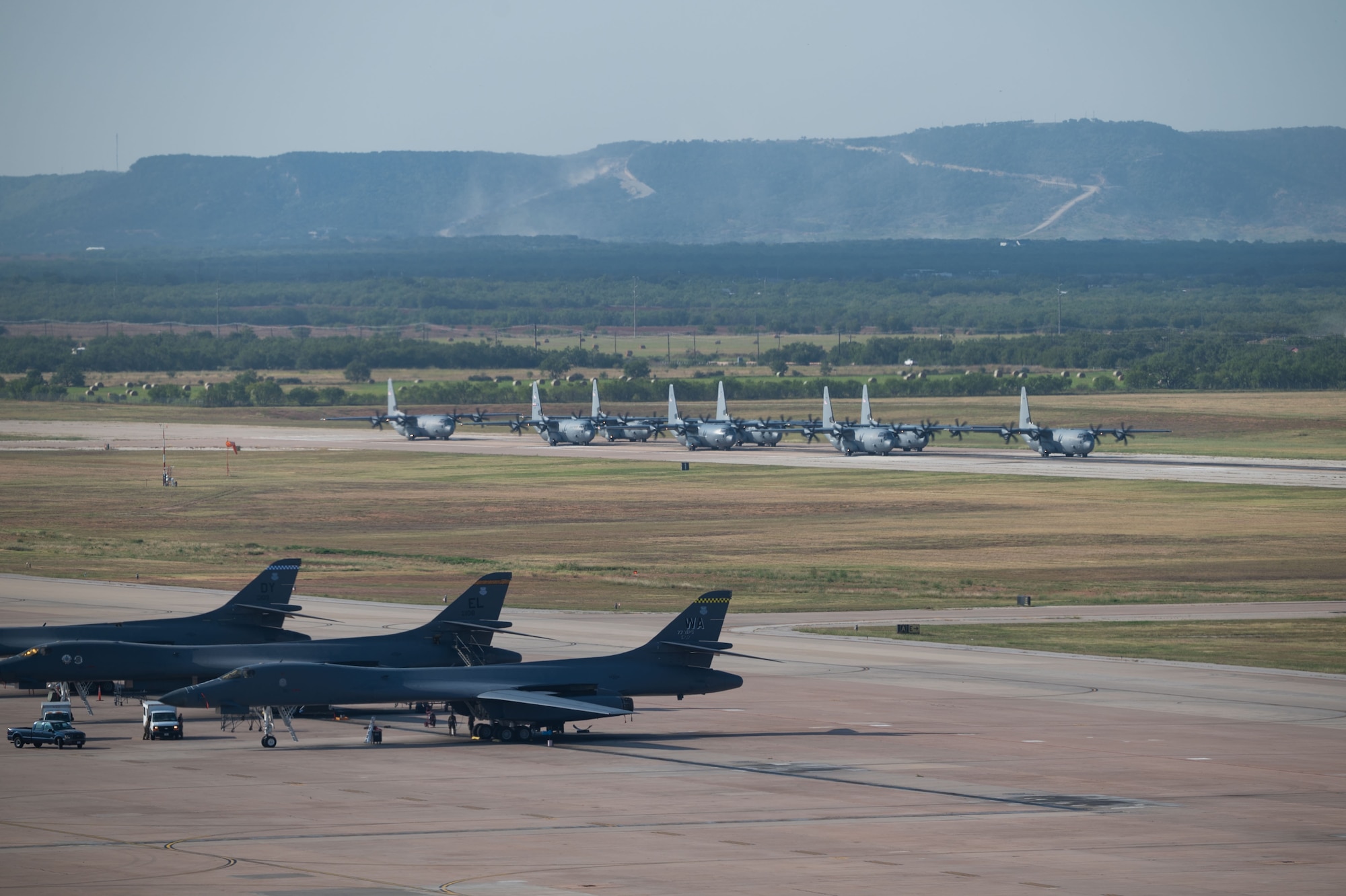 Airmen sit around a conference table
