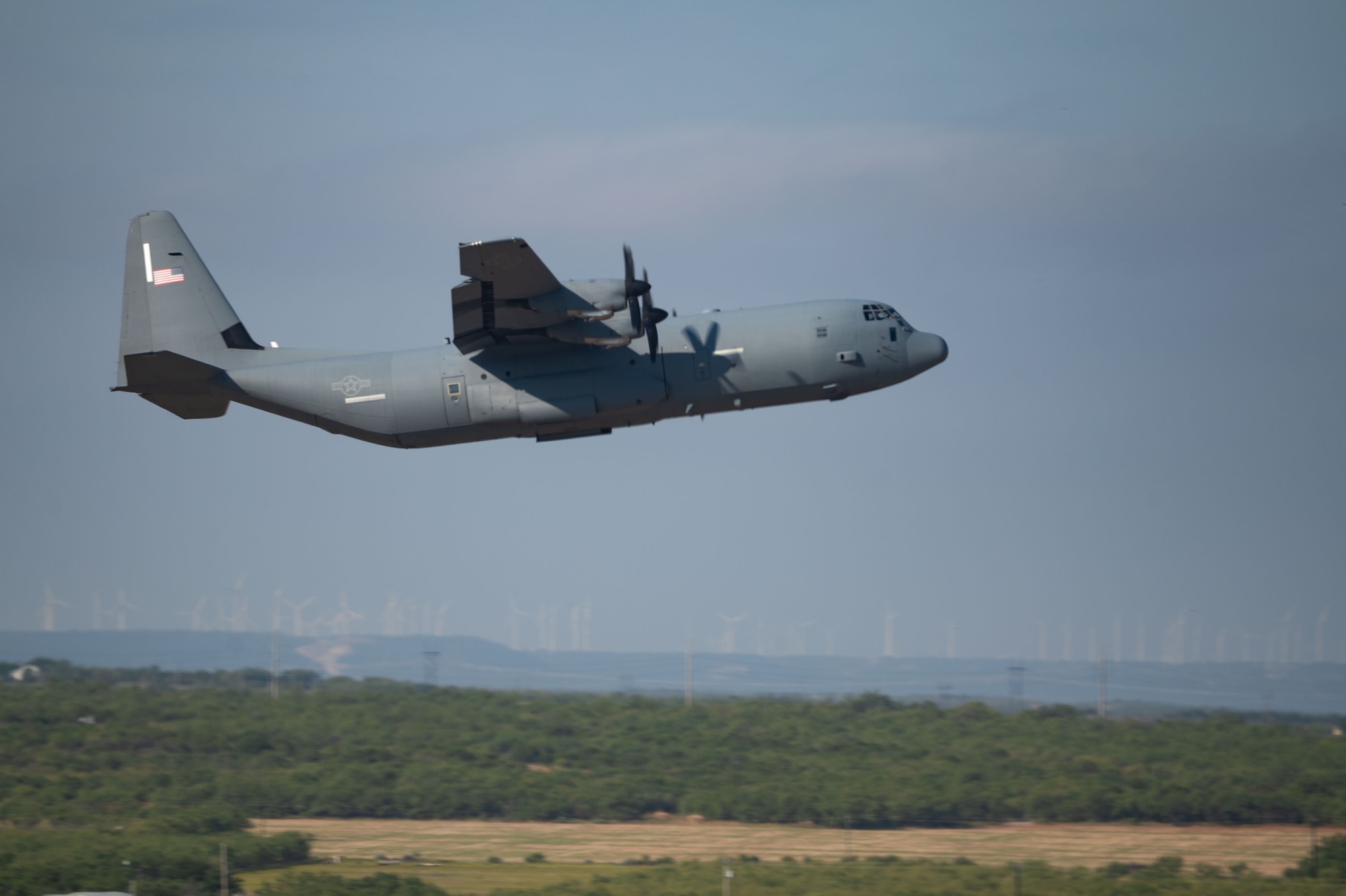 Airmen sit around a conference table