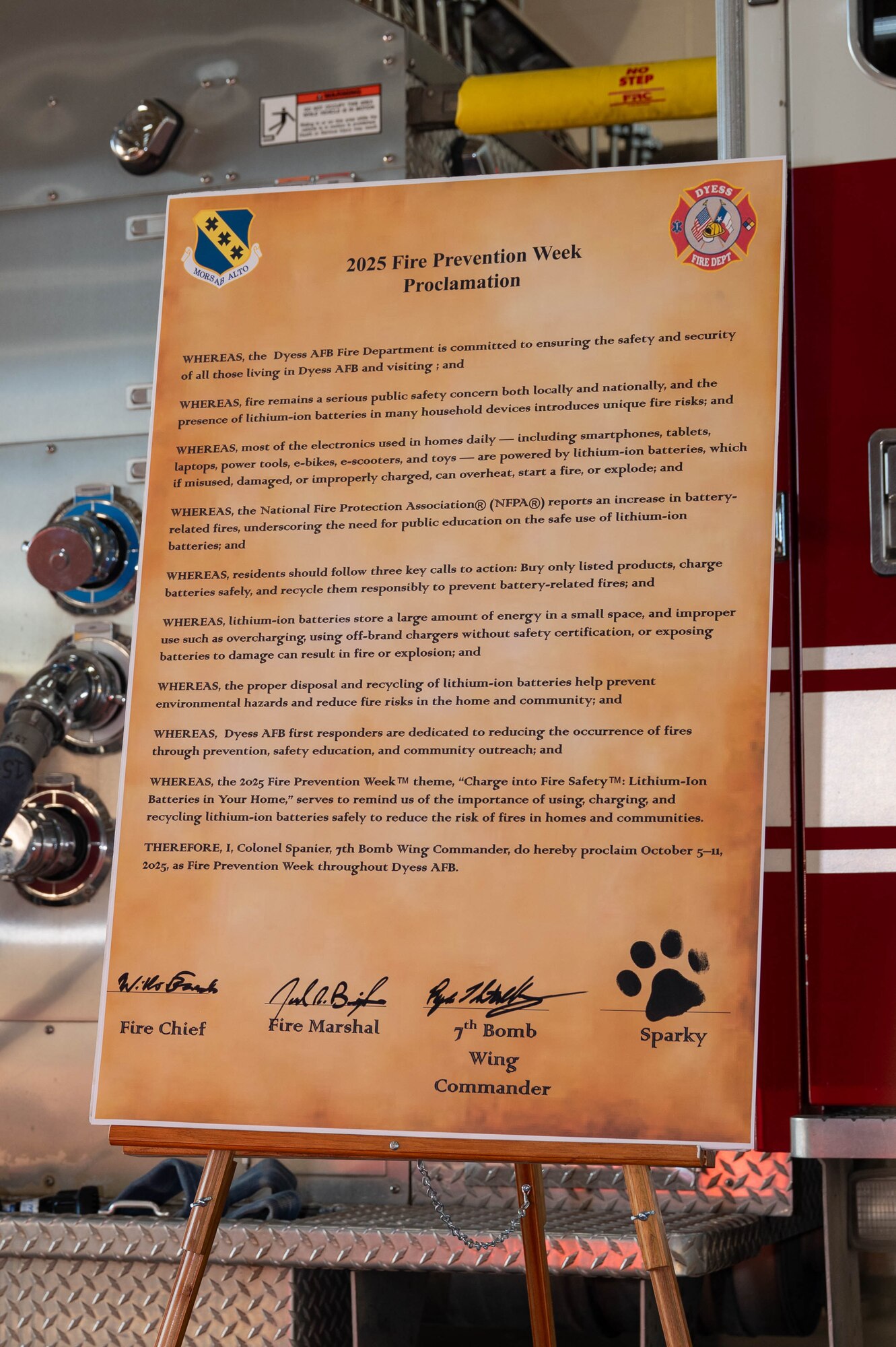 A signed proclamation for Fire Prevention Week sits on display at Dyess Air Force Base, Texas, Oct. 2, 2025. This year’s campaign, “Charge into Fire Safety: Lithium-Ion Batteries in Your Home,” focuses on teaching the public how to safely buy, charge, and dispose of lithium-ion batteries commonly found in household devices to prevent fires. (U.S. Air Force photo by Airman William Neal)